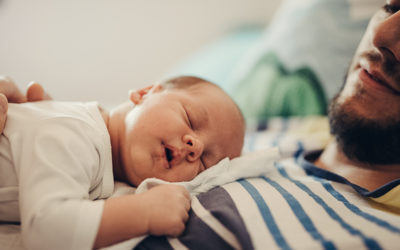 baby sleeping on dad's chest