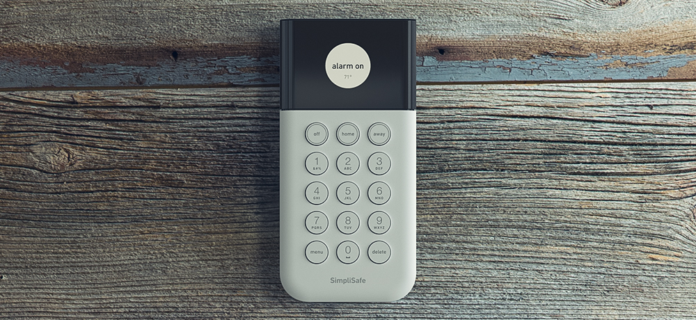 simplisafe keypad on wooden background