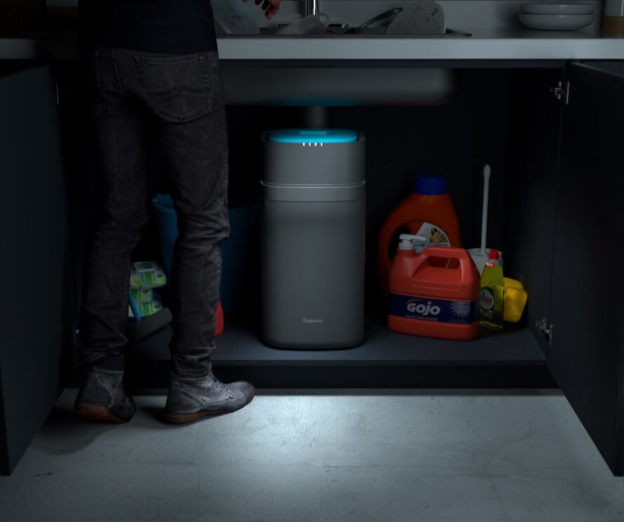 gray and blue compost bin connected to kitchen sink