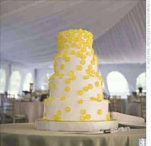 the cake for wedding decorated with yellow