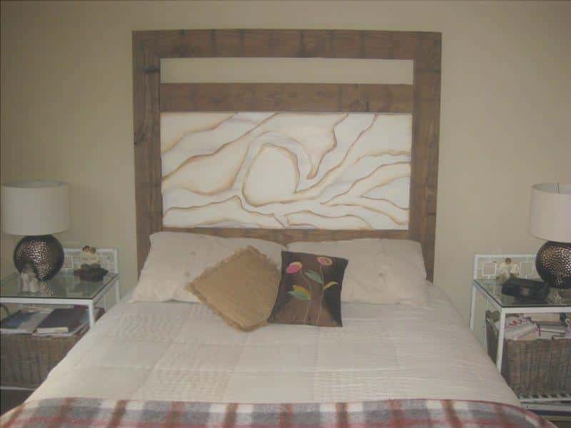 the headboard of the wood bed