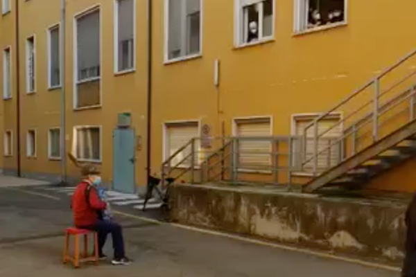 In an image from a video, Stefano Bozzini, 81, played the accordion for his wife, Carla Sacchi, earlier this month.