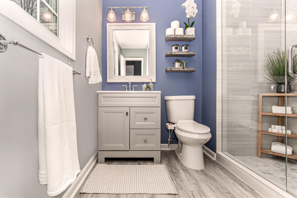 a blue master bathroom with vanity and shower in Atlanta