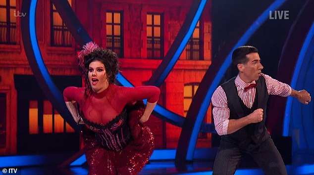 Having fun: The WAG appeared to be having a great time as she grinned during the dance